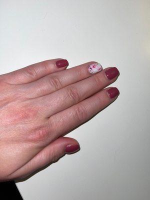 A nice acrylic overlay on natural nails with mauve gel polish and a floral transfer design