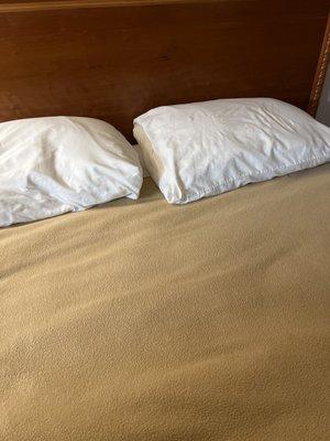 If you look by the pillows you can see stains.