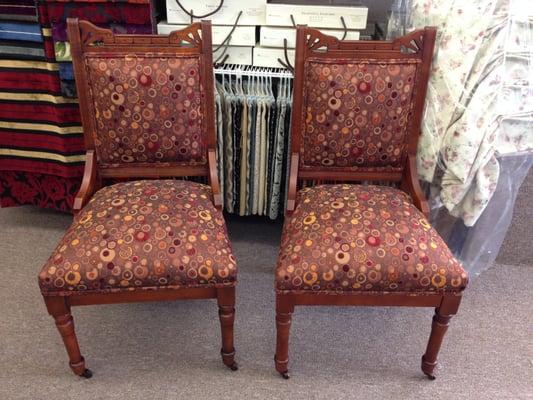 Antique chairs with a modern fabric.