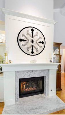 Thinking outside of the box is a great thing! Setting this stone medallion over the mantle really makes a statement.