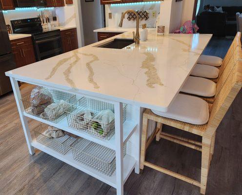 Quartz countertop and backsplash.