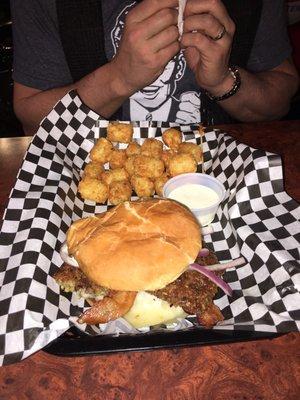 Burger with goetta, bacon and pepper jack cheese and tater tots