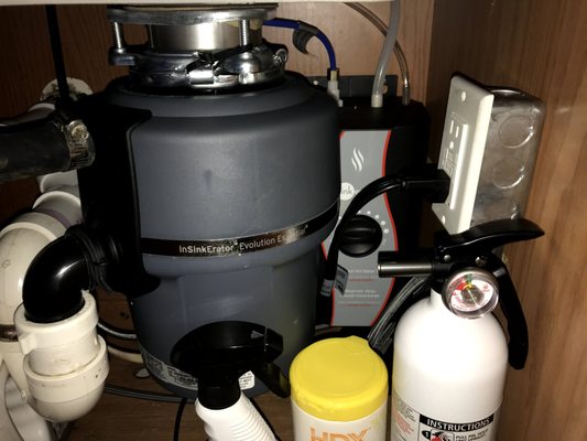 Note the hot water tank tucked _behind_ the garbage disposal. How he got back there I'll never know, but greatly appreciate!