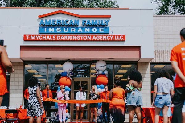 Cutting the ribbon at the T-Mychals Darrington Agency, LLC. Grand Opening