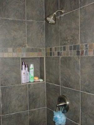 custom recessed shower shelf & decorative tile band