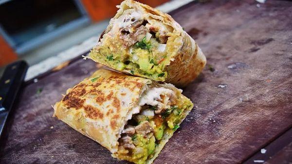 the famous beef fajita burrito is to die for filled with all the goodies #mouthwatering