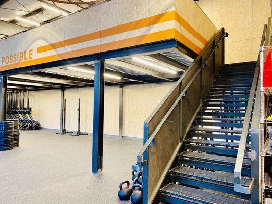 Gym stairway leading to mezzanine