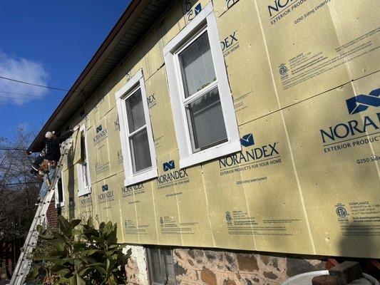 Fan fold insulation install prior to new siding.