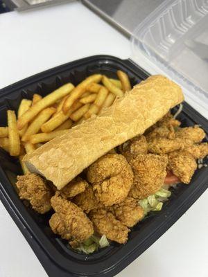 Fried Shrimp Po'boy on a French bread with lettuce, tomato, and our Cajun Ray's sauce. Served with fries