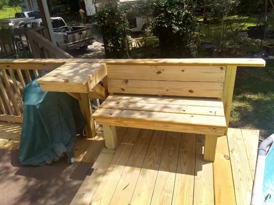 Small pool deck with bench and table