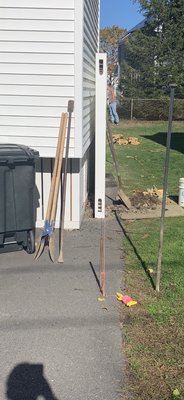 This is MY driveway and MY house...the NEIGHBOR is the one putting in the fence!!! Those are their tools leaning on MY house!