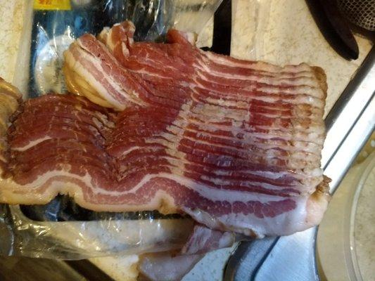 Bad bacon, part you see looks fresh, bottom looks scary.