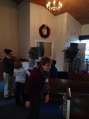 Congregation decorating church for Christmas.