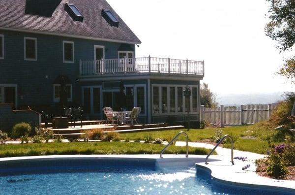 Lawn care and landscaping at a backyard oasis.