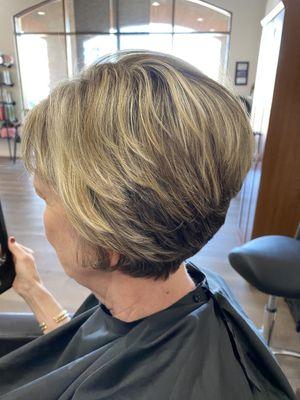 Hair Color: blonde highlights working with the natural color. Haircut: short and fun.