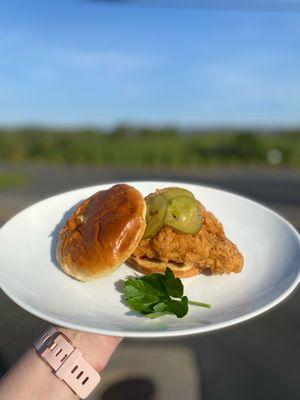 Crispy, golden fried chicken sandwich topped with Chef Doug's house made pickles!