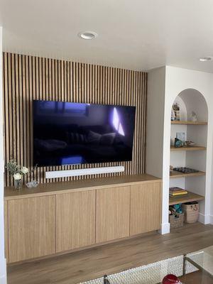 Tv den with build in cabinets and shelves