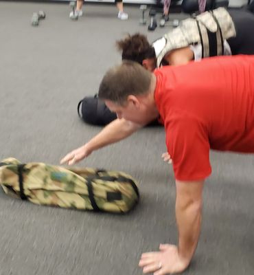 Working up a sweat using sandbags during our boot camp class this morning here in Sellersville.