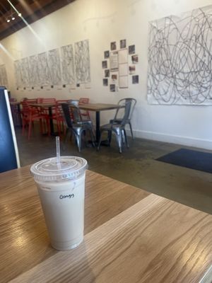 Large Iced Latte and seating area