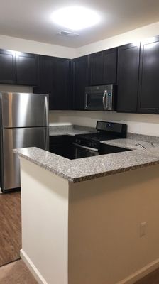 Kitchen with stainless steel appliances.