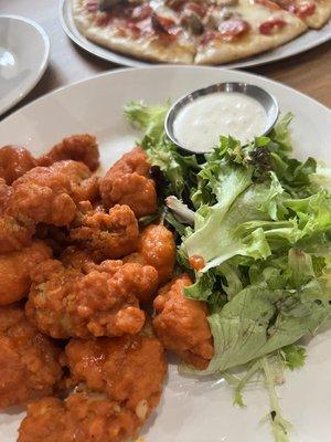 Boneless chicken and cauliflower bites with buffalo sayce