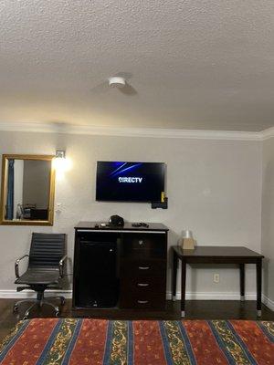 Mounted TV with cable Fridge/Drawers  Table with chair