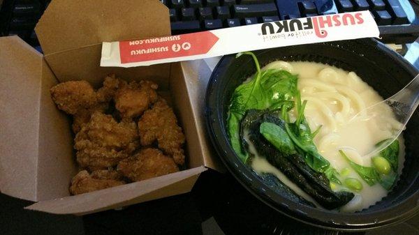 Udon in tonkotsu broth with crispy chicken on the side, spinach, seaweed and edamame, now with a plastic soup spoon!