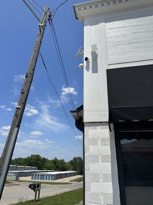 Installed cameras along with solar panels one of the Polk business center.