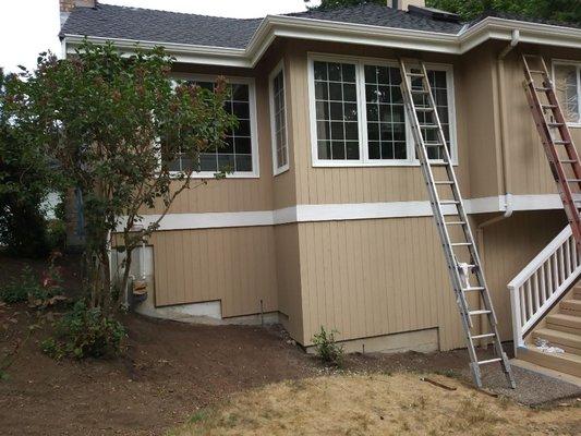 Removing all masking paper from windows.