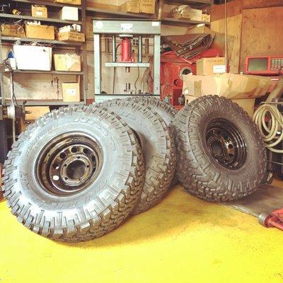 New 315/75r16 Nitto Trail Grappler Tires on 16" Steel Wheels for the Defender. Even painted the wheel weights to matching black to blend in.