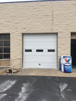 Industrial insulated sectional door with windows