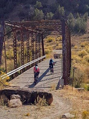 We are crossing the decommissioned bridge as part of the Gravel Grinder route offered through the San Juan Hut System.