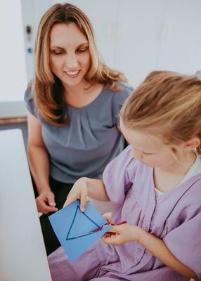 Modified scissors can support kids who may struggle with cutting.