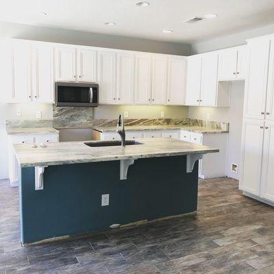 Kitchen remodel to include ample counterspace, custom cabinetry and island with space for barstools!