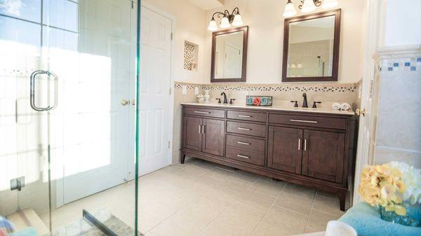 Vanity and ivory tile floor