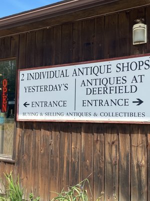 Sign on the building (when facing the building).  Sign by the road says "Antique Center"