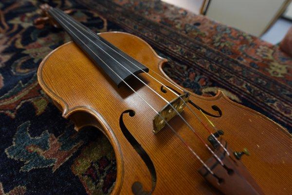 5/23/2017 - My violin before servicing had a huge buildup of rosin and a fingerboard that needed resurfacing.