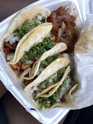 one of each taco on flour, grilled onions