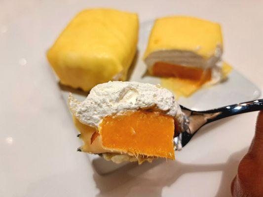 P1: Mango Fluffy Pillow Cake order comes with two. So heavenly! Half a mango and whip cream wrapped in a mango crepe.