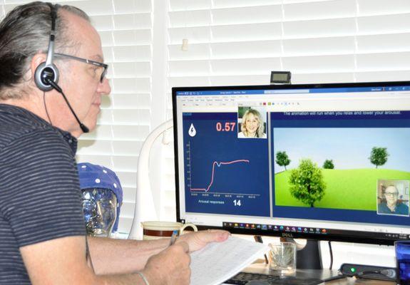 Helping patient with hand temperature biofeedback learn how to elicit the relaxation response so she can generalize at home and  office.