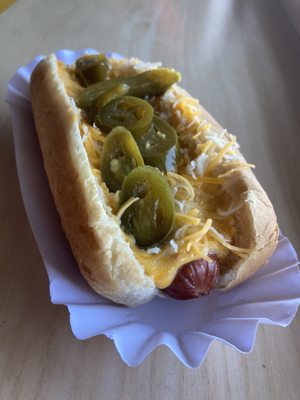 Kill devil dog with nacho cheese, shredded cheese and pickled jalapeños