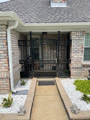 Foyer gates for stylish front porch.