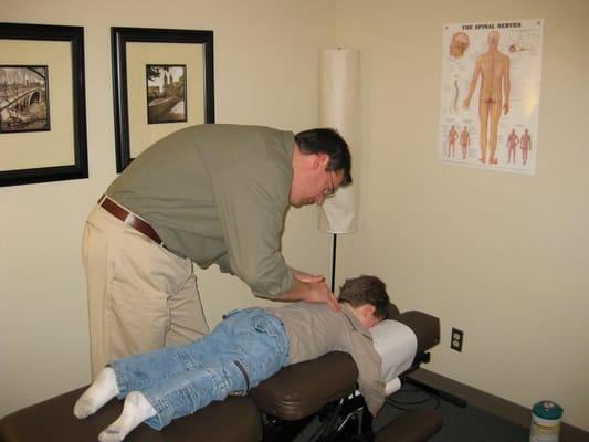 Dr. Bradley adjusting a patient.