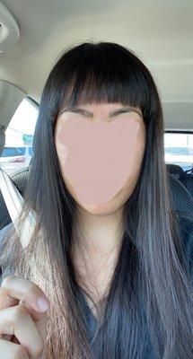 Straight across bang cut immediately after leaving salon. Crooked, uneven, too much of the sides cut off so too short.