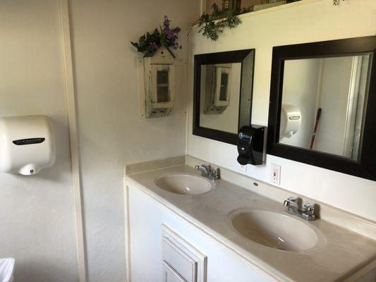 Sinks in women's bathroom house, super clean