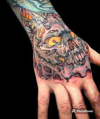 Bio-mech skull hand tattoo done by Chris Edmondson