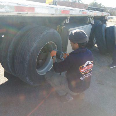 Replacing tires on a 18 wheeler.