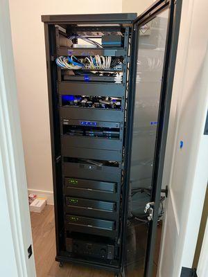 Whole home network, security, and audio/video distribution equipment rack