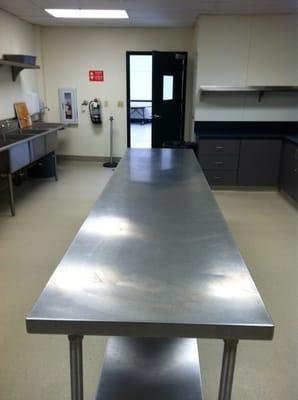 Kitchen prep table simply amazing and a super clean kitchen!  Great solution for brides planning a budget wedding!