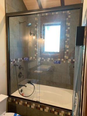 Frameless Double Slide Shower Enclosure, 3/8 Clear Glass, Oil Rubbed Bronze Aluminum Finish.